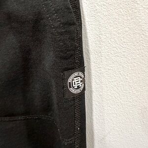 REIGNING CHAMP BLACK SWEATPANTS